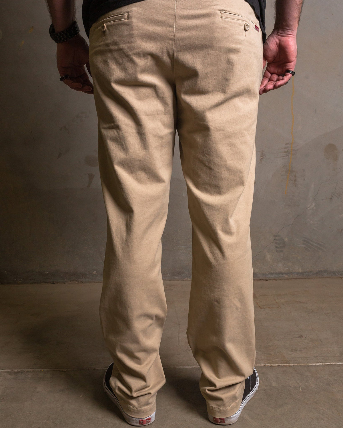 Dixxon Canada. Khaki Chino Pants. Side-back view displaying the slim fit, welt pockets, and the discreet stash pocket at the right hip.