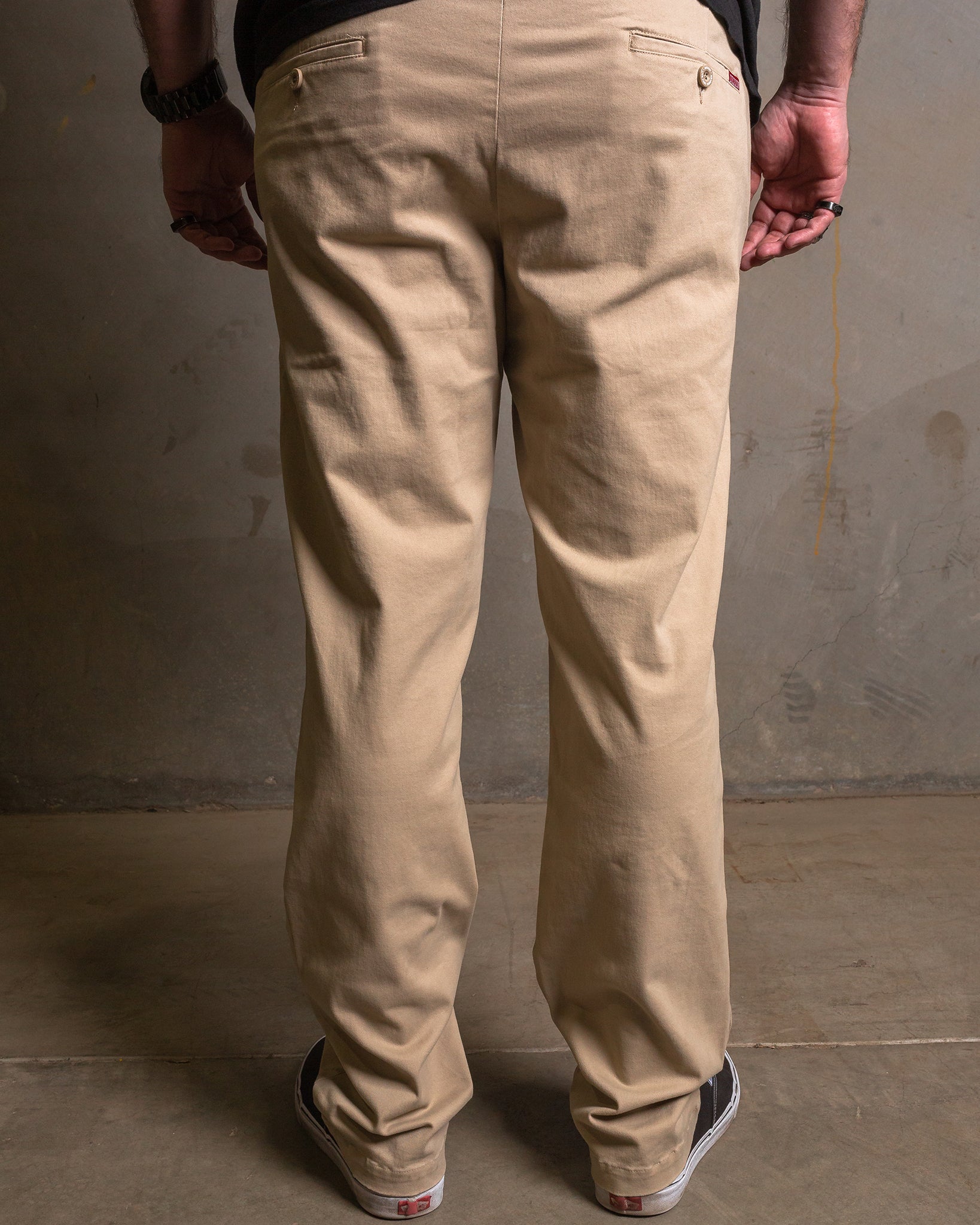 Dixxon Canada. Khaki Chino Pants. Side-back view displaying the slim fit, welt pockets, and the discreet stash pocket at the right hip.